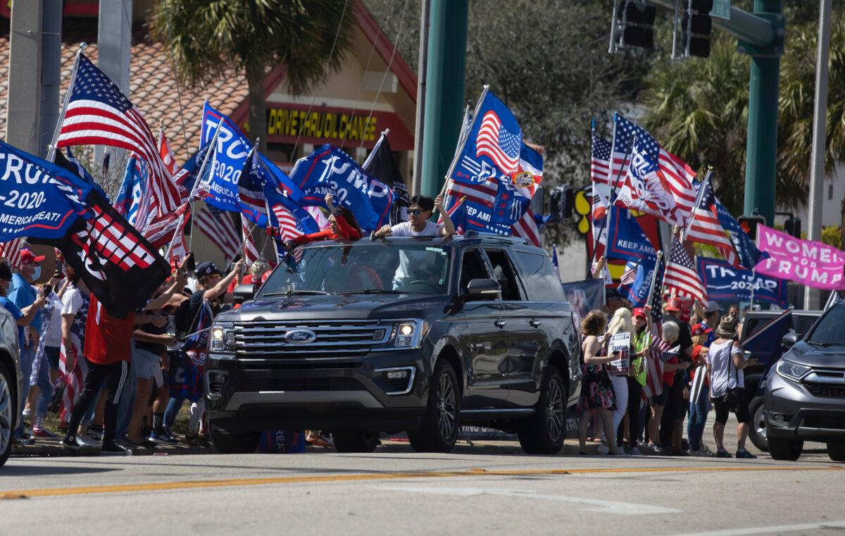 Supporters of former President Donald Trump gather along Southern Blvd near Trump's Mar-a-Lago home in West Palm Beach, Fla., on Feb. 15, 2021. (Joe Raedle/Getty Images)
