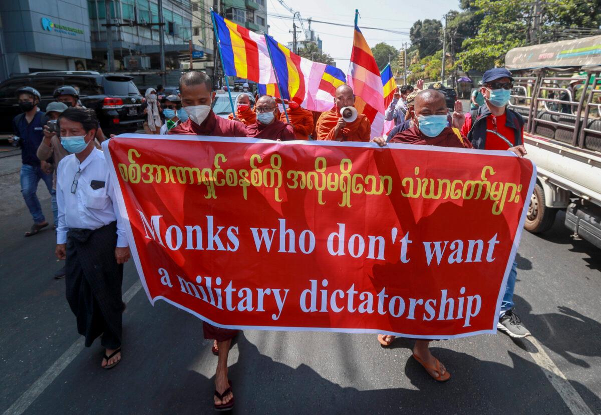 Buddhist monks march during a protest against the military coup in Yangon, Burma, on Feb. 16, 2021. (AP Photo)