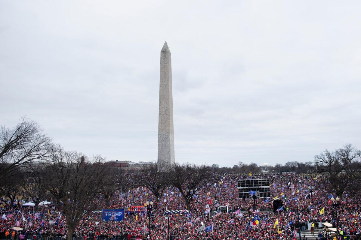  Supporters wait on the National Mall during a rally wherein President Donald Trump challenged the results of the 2020 U.S. presidential election on the Ellipse in Washington on Jan. 6, 2021. (Brendan Smialowski/AFP via Getty Images)