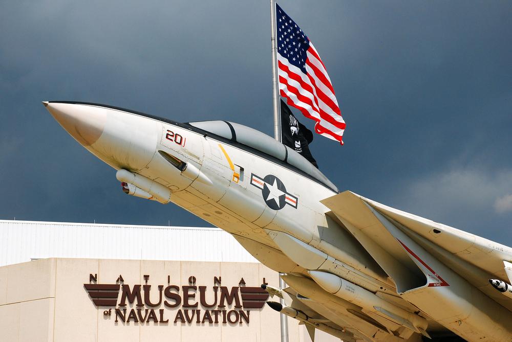An F-14 appears to soar outside of the National Museum of Naval Aviation. (James Kirkikis/Shutterstock)