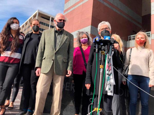 Kathleen McIlvain (C) speaks outside federal court after the court appearance of Jerry Boylan, a scuba dive boat captain who is charged with 34 counts of seaman's manslaughter, in Los Angeles on Feb. 16, 2021. (Stefanie Dazio/AP Photo)