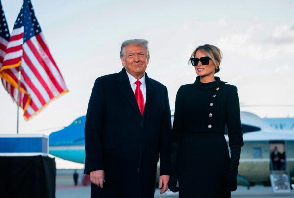 Former U.S. President Donald Trump and First Lady Melania Trump address guests at Joint Base Andrews in Maryland on Jan. 20, 2021. (ALEX EDELMAN/AFP via Getty Images)