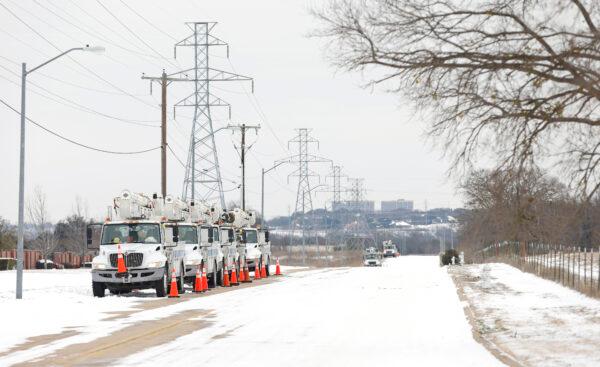 Pike Electric service trucks line up after a snow storm in Fort Worth, Texas, on Feb. 16, 2021. (Ron Jenkins/Getty Images)