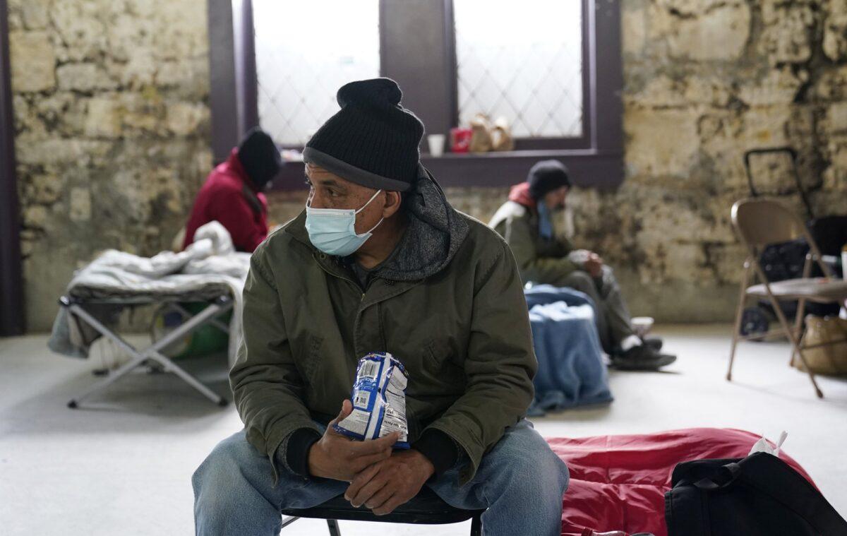 People seeking shelter from sup-freezing temperatures gather at a make-shift warming shelter at Travis Park Methodist Church in San Antonio, Texas, on Feb. 16, 2021. (Eric Gay/AP Photo)