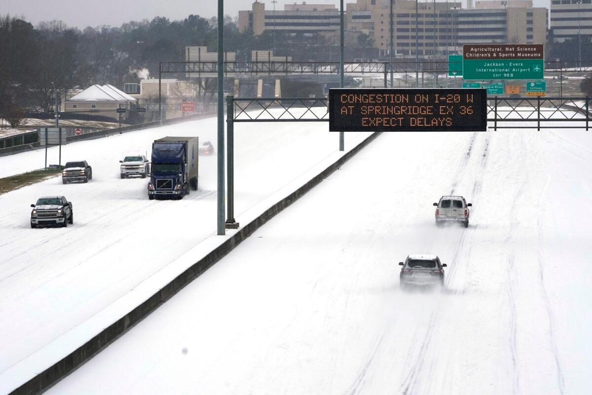 An electronic message board advises drivers of potential congestion on the intersecting interstate as they drive south on Interstate 55 in north Jackson, Miss., on Feb. 15, 2021. (Rogelio V. Solis/AP Photo)