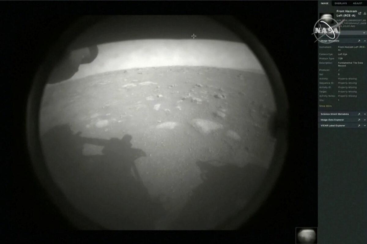 The first images arrive moments after NASA's Perseverance Mars roverspacecraft successfully touched down on Mars, at NASA's Jet Propulsion Laboratory in Pasadena, Calif., on Feb. 18, 2021. (NASA TV/Handout via Reuters)
