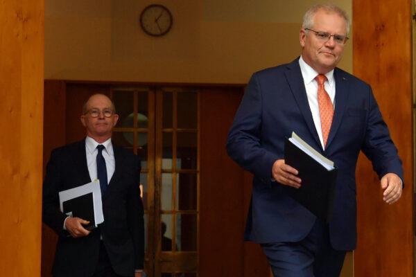 CANBERRA, AUSTRALIA - FEBRUARY 05: Prime Minister Scott Morrison (right) arrives with Chief Medical Officer Paul Kelly (left) during a press conference in the Prime Minister's Courtyard on February 05, 2021 in Canberra, Australia. (Photo by Sam Mooy/Getty Images)