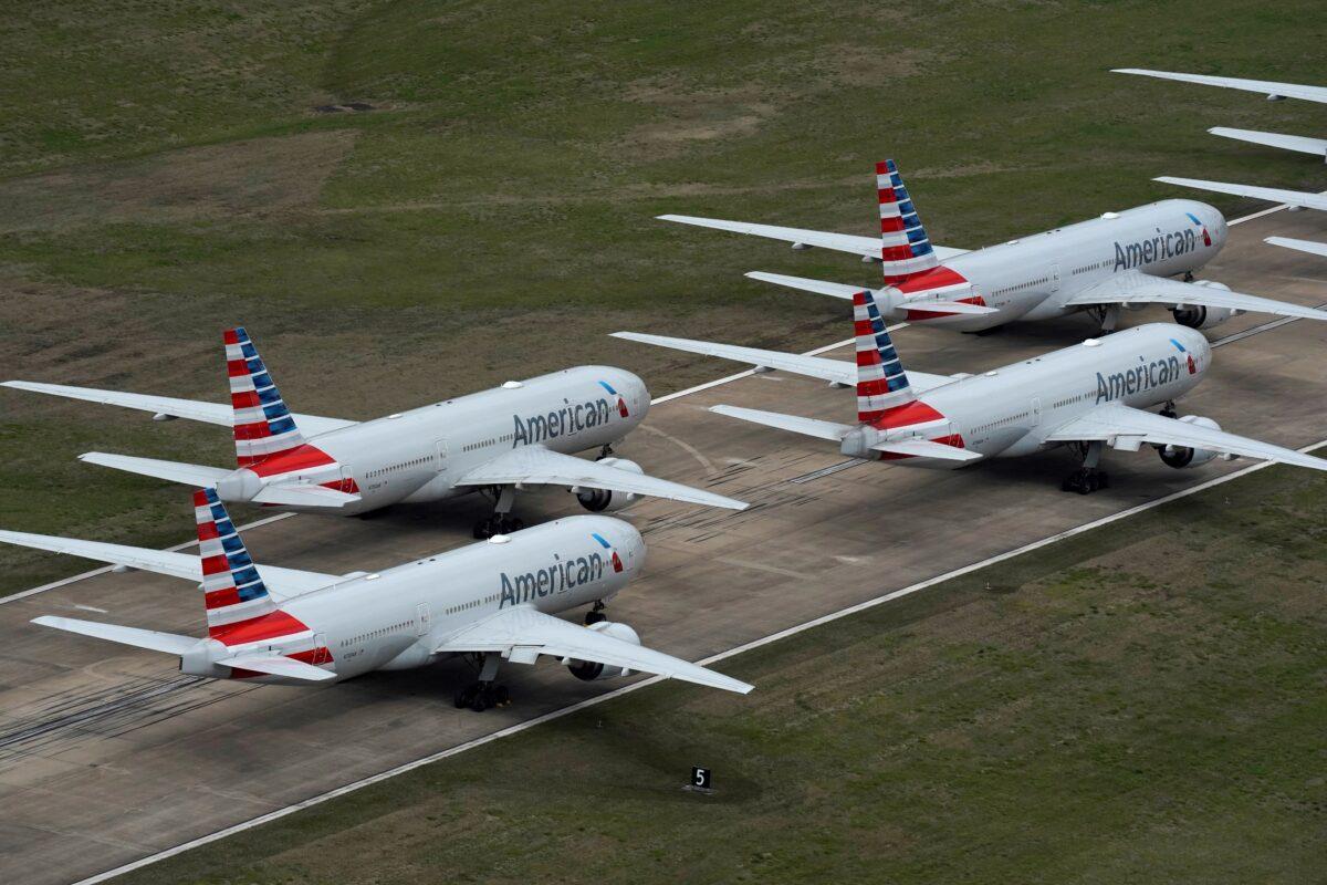 American Airlines passenger planes crowd a runway, at Tulsa International Airport in Tulsa, Okla., on March 23, 2020. (Nick Oxford/Reuters, File Photo)