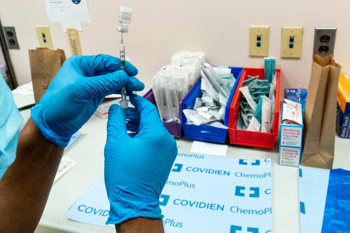 A pharmacist prepares a syringe with the Pfizer-BioNTech COVID-19 vaccine at a vaccination site at NYC Health + Hospitals Metropolitan in New York on Feb. 18, 2021. (Mary Altaffer/AP Photo)