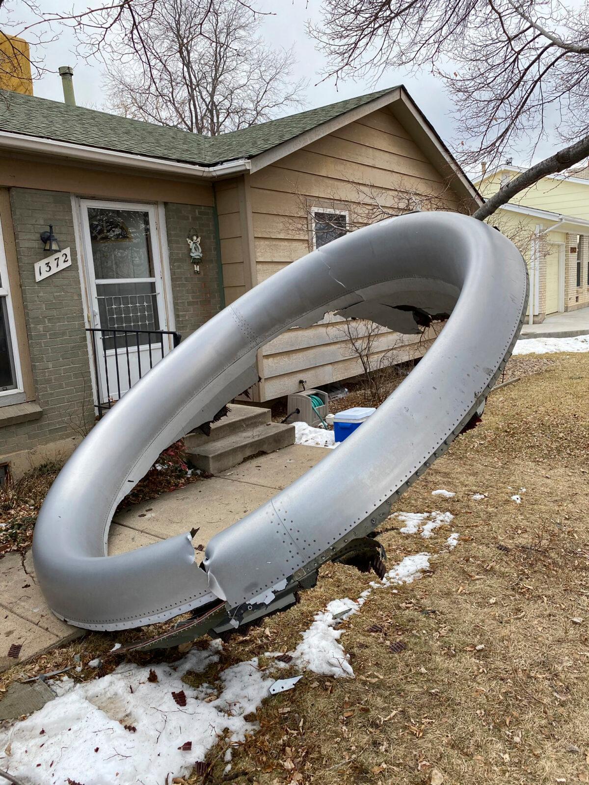 Debris is scattered in the front yard of a house at near 13th and Elmwood, in Broomfield, Colo., on Feb. 20, 2021. (Broomfield Police Department via AP)