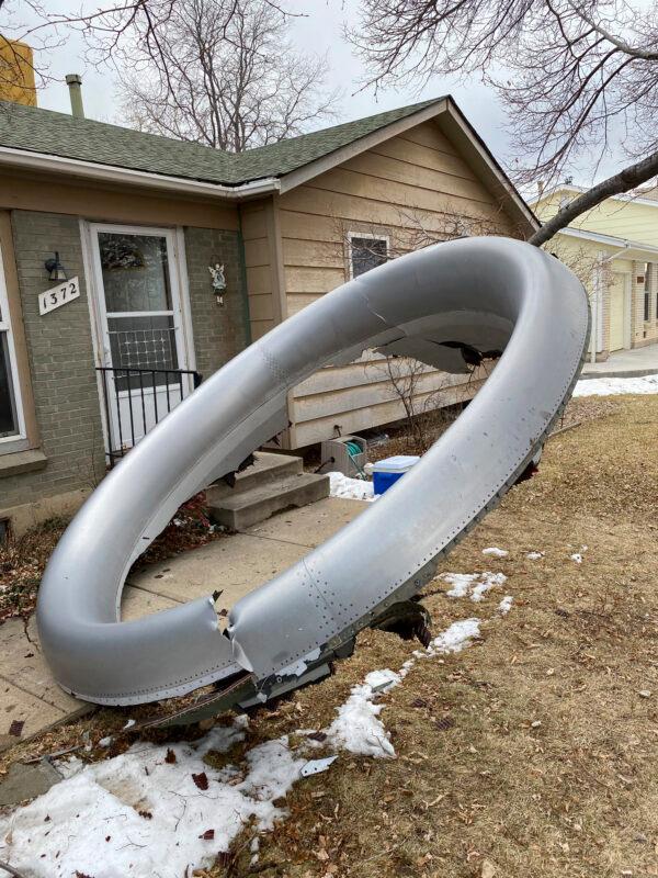 Debris is scattered in the front yard of a house at near 13th and Elmwood, in Broomfield, Colo., on Feb. 20, 2021. (Broomfield Police Department via AP)