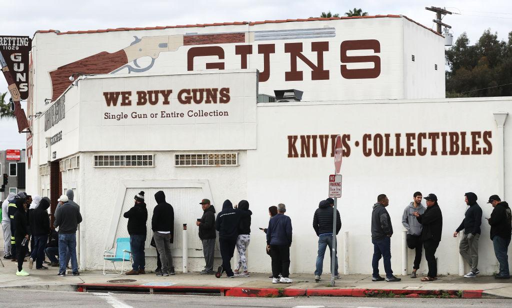 People stand in line outside the Martin B. Retting, Inc. guns store in Culver City, Calif. on March 15, 2020. (Mario Tama/Getty Images)