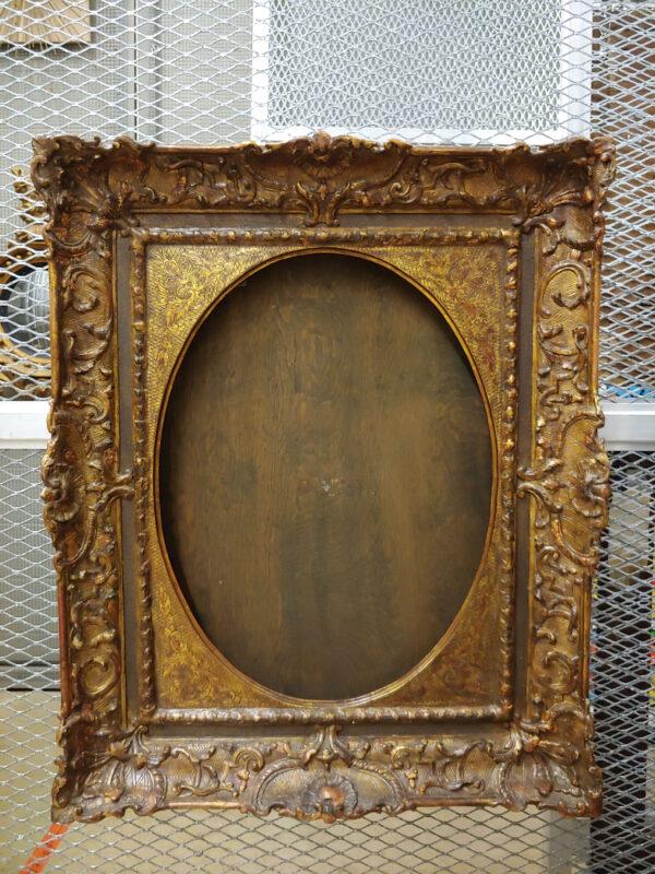 Rembrandt's "Portrait of a Young Woman" used to be displayed in this 19th-century reproduction of a heavily carved 18th-century gilt frame. (Allentown Art Museum)