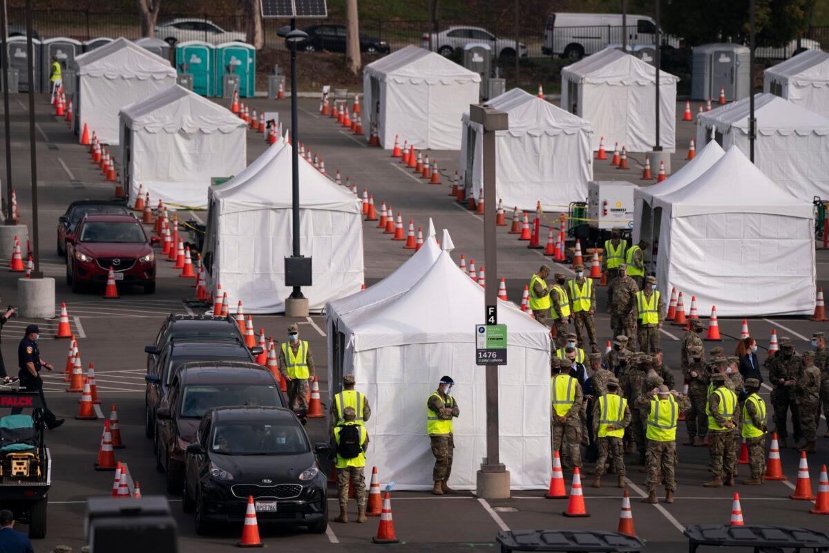 Motorists wait to get their COVID-19 vaccine at a federally-run vaccination site set up on the campus of California State University of Los Angeles in La., on Feb. 16, 2021. (Jae C. Hong/AP Photo, File)