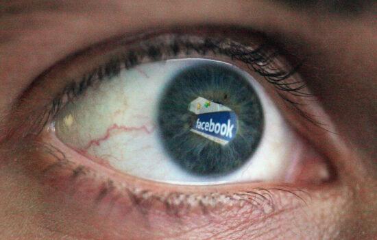 In this photo illustration the Social networking site Facebook is reflected in the eye of a man on March 25, 2009 in London, England. (Dan Kitwood/Getty Images)