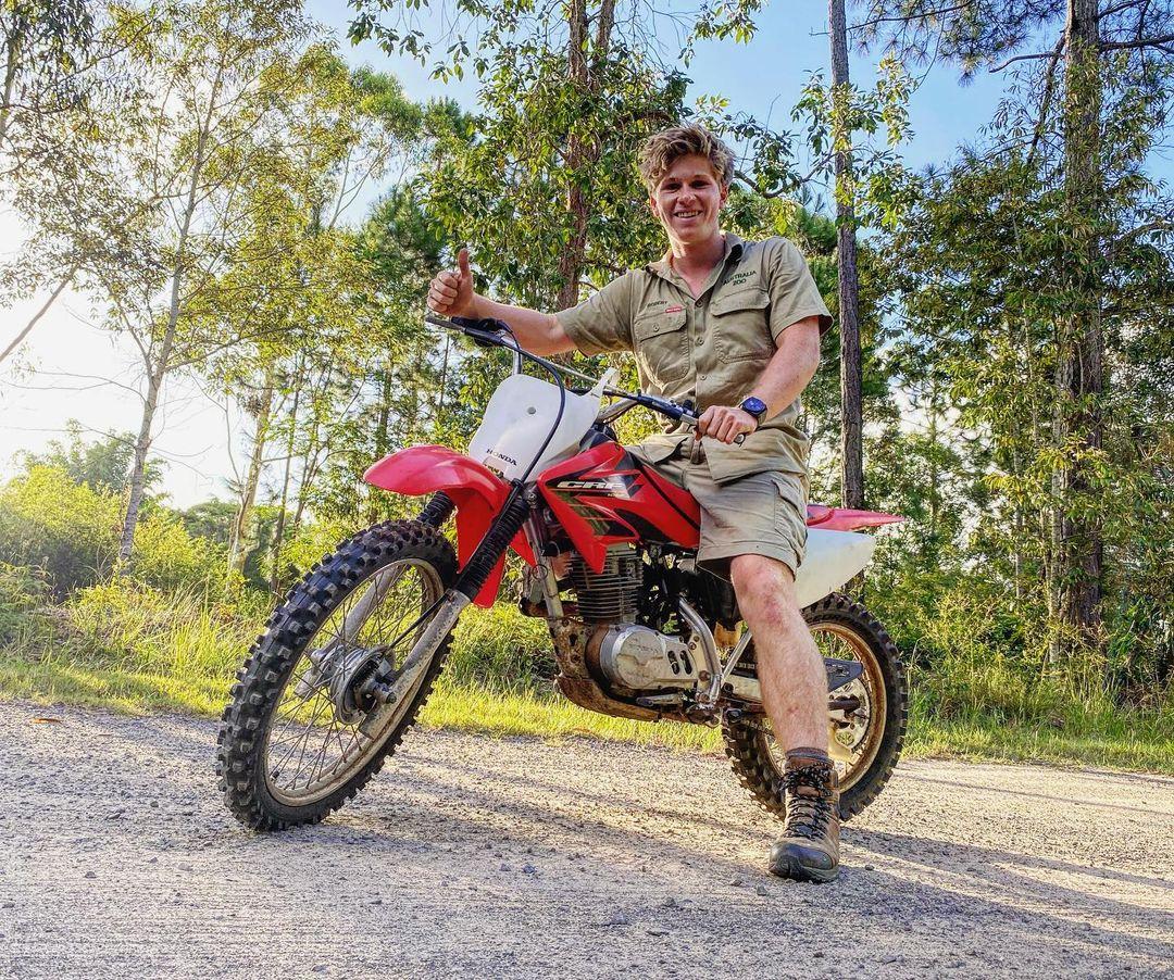 Robert Irwin with the late Steve Irwin's vintage Honda motorbike at Australia Zoo in Queensland on Feb. 12, 2021. (Courtesy of <a href="https://www.instagram.com/robertirwinphotography/">Robert Irwin</a> via <a href="https://www.facebook.com/AustraliaZoo">Australia Zoo</a>)