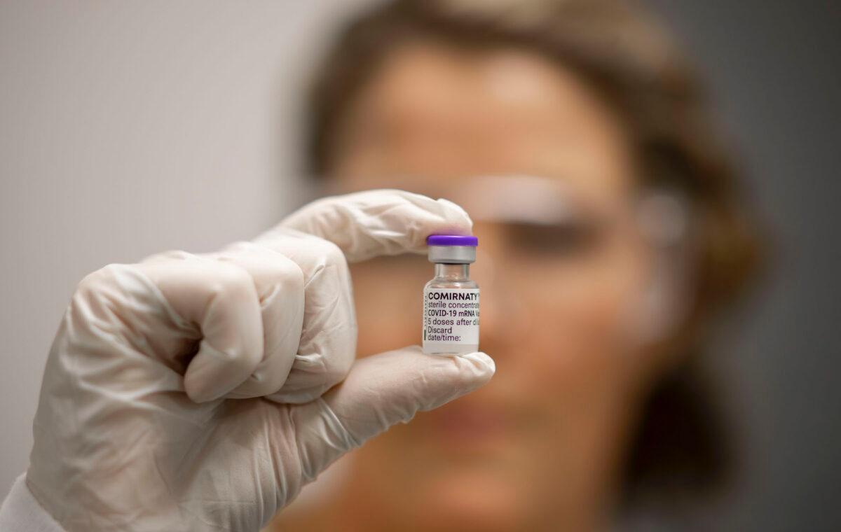 A vile of COVID-19 vaccine is held by Advanced Pharmacist Rachael Raleigh at Gold Coast University Hospital in Gold Coast, Australia on Feb. 22, 2021. (Glenn Hunt/Getty Images)
