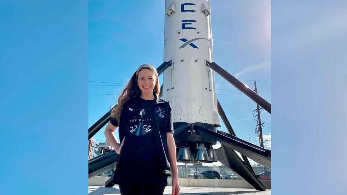 Hayley Arceneaux stands near a SpaceX rocket at the aerospace company's headquarters in Hawthorne, Calif., in this undated photo. (St. Jude Children’s Research Hospital via AP)