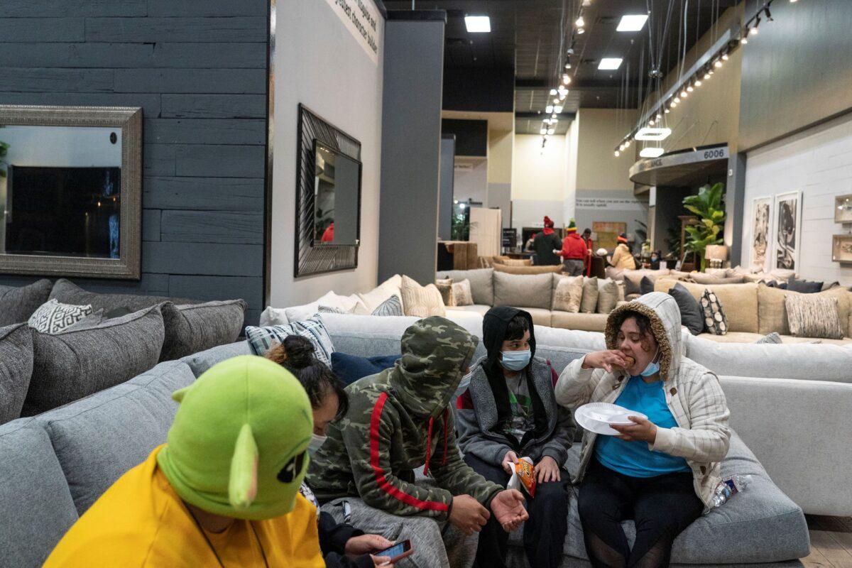 People take shelter at Gallery Furniture store after winter weather caused electricity blackouts in Houston, Texas, on Feb.18, 2021. (Go Nakamura/Getty Images)