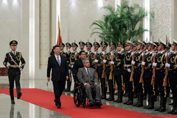 Ecuador's President Lenin Moreno (R) and Chinese leader Xi Jinping review an honor guard at the Great Hall of the People in Beijing, China, on Dec. 12, 2018. (Andy Wong/AP Photo)