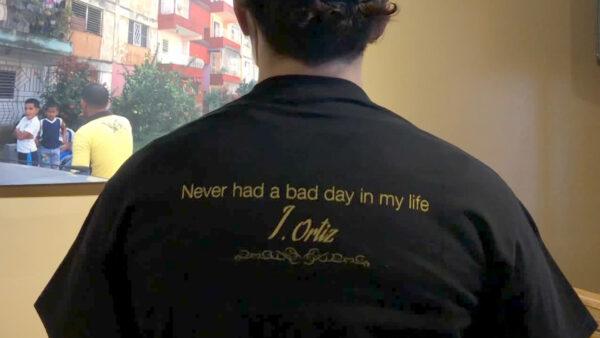 The back of a T-shirt with Julio Ortiz’s motto printed on it, on Feb. 14, 2021. (Echo Liu/The Epoch Times)