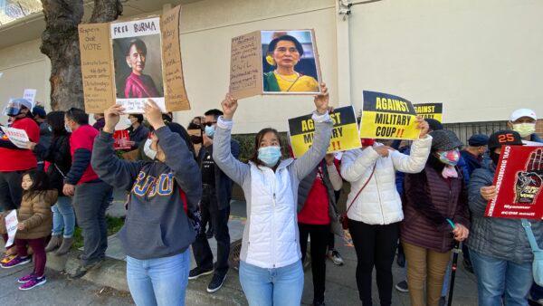 Protesters hold signs outside the Chinese Consulate in San Francisco on Feb. 20 to call for an end to the Chinese regime’s support for the Burmese military coup. (Nancy Han/The Epoch Times)