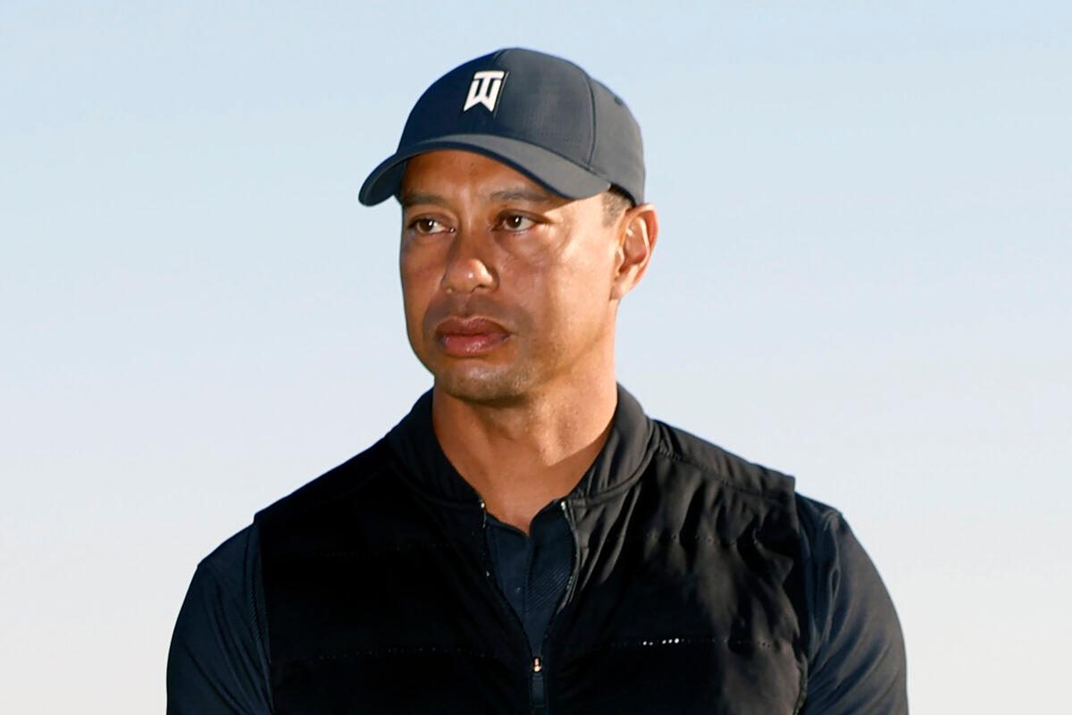 Tiger Woods looks on during the trophy ceremony on the practice green after the final round of the Genesis Invitational golf tournament at Riviera Country Club, in the Pacific Palisades area of Los Angeles, Calif., on Feb. 21, 2021. (Ryan Kang/AP Photo)