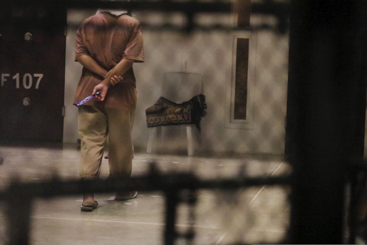 A detainee paces in a cell block while being held in Joint Task Force Guantanamo's Camp VI at the U.S. Naval Base in Guantanamo Bay, Cuba, on March 22, 2016. (Lucas Jackson/File Photo/Reuters)