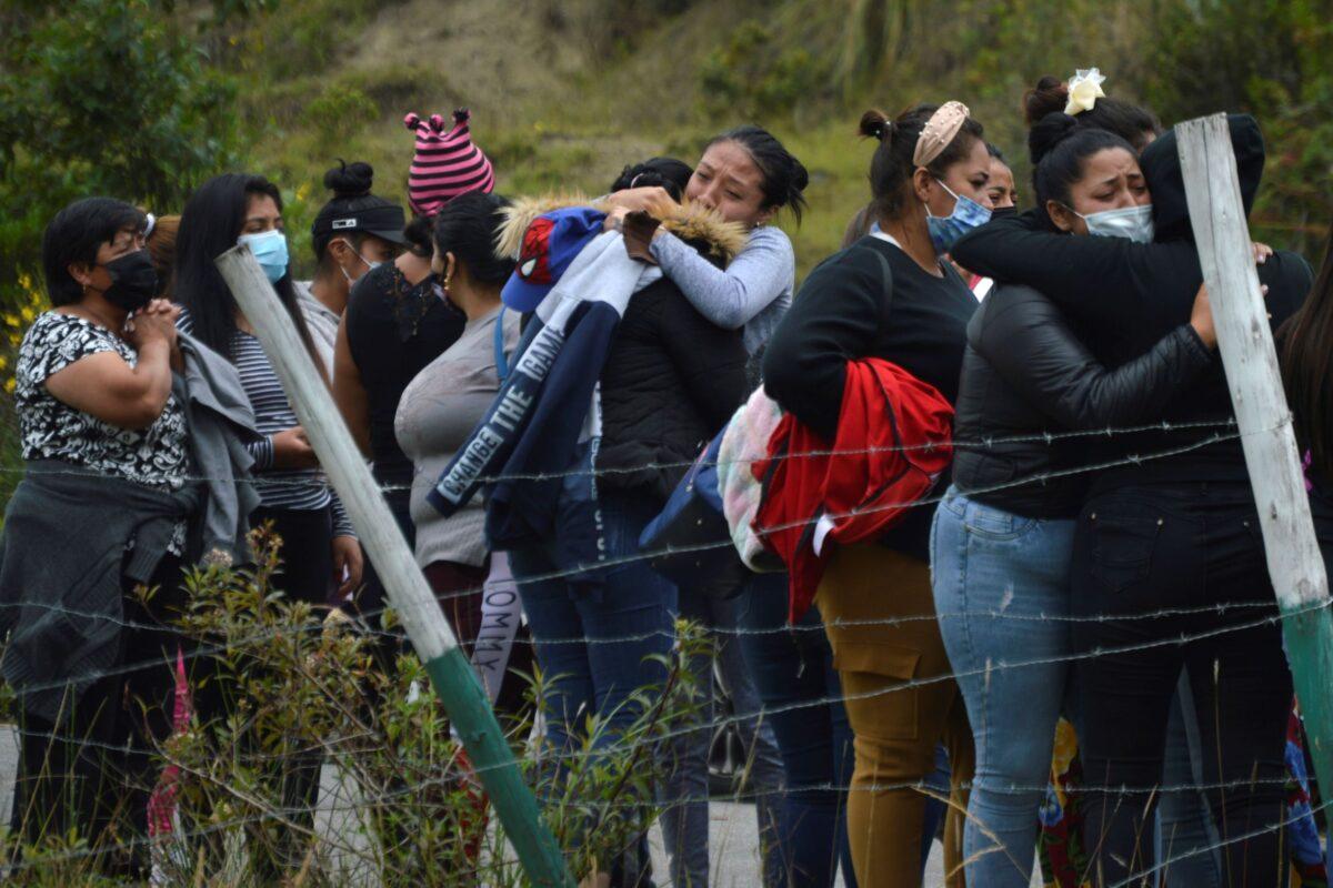  Prisoners' relatives gather outside Turi jail where an inmate riot broke out in Cuenca, Ecuador, on Feb. 23, 2021. (Boris Romoleroux/API via AP)