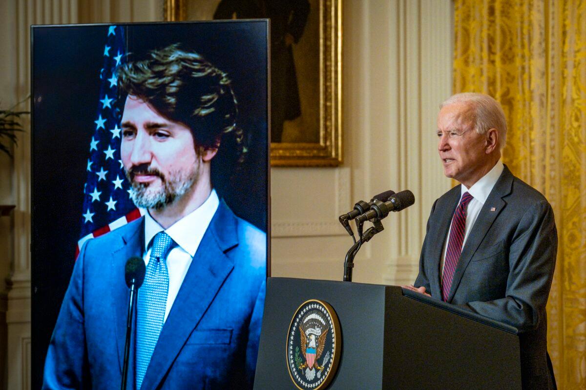 President Joe Biden and Canadian Prime Minister Justin Trudeau deliver opening statements via video link in the East Room of the White House on Feb. 23, 2021. (Pete Marovich/Pool/Getty Images)