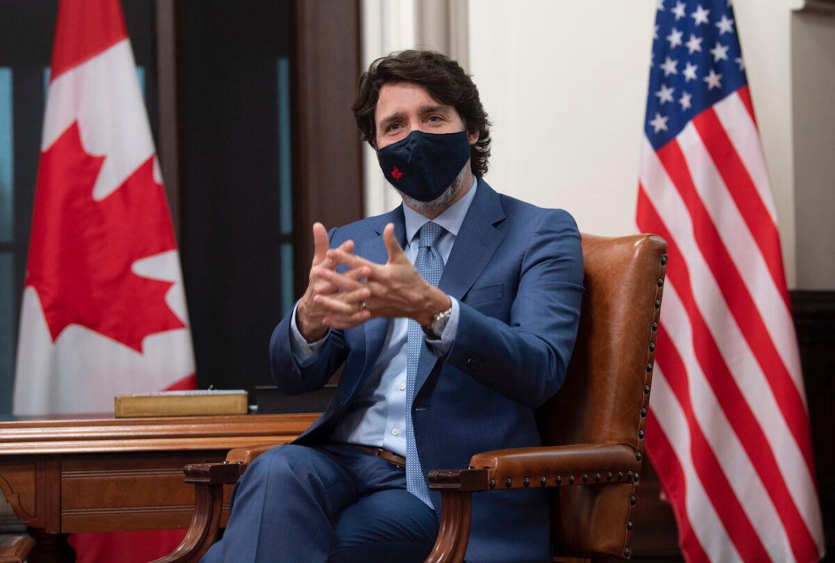 Canadian Prime Minister Justin Trudeau is seen as he speaks virtually with United States President Joe Biden from his office on Parliament Hill in Ottawa, Canada, on Feb. 23, 2021. (Adrian Wyld/The Canadian Press via AP)