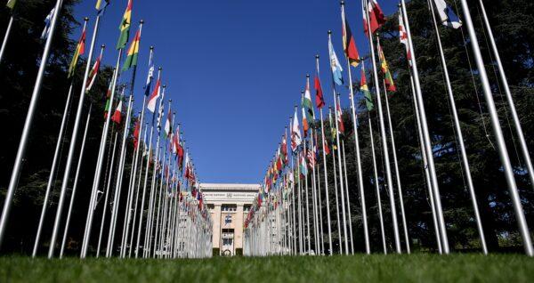 The "Palais des Nations", which houses the United Nations Offices, is seen at the end of the flag-lined front lawn in Geneva on Sept. 4, 2018. (Fabrice Coffrini/AFP via Getty Images)
