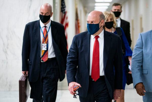 United States Postal Service Postmaster General Louis DeJoy departs following a hearing on Capitol Hill in Washington on Feb. 24, 2021. (Al Drago/Getty Images)