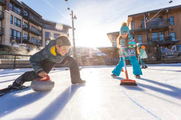 Kids curling on the rink. (Jeremy Swanson/Snowmass Tourism)