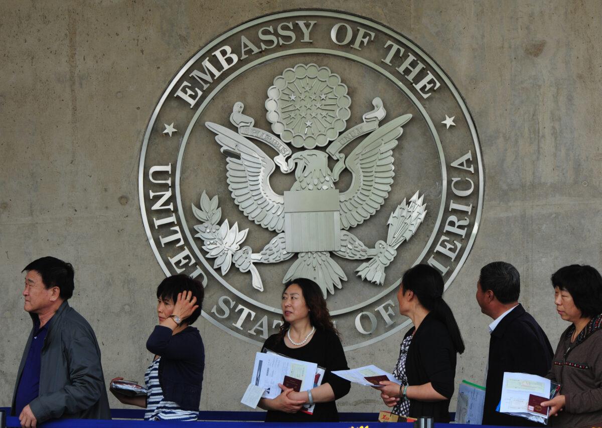 Chinese citizens wait to submit their visa applications at the US Embassy where blind rights activist Chen Guangcheng is believed to be hiding, in Beijing on May 2, 2012. (Mark Ralston/AFP/GettyImages)