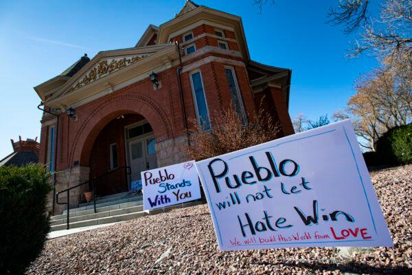 Signs, flowers, and candles expressing love for the Jewish community stand outside the Temple Emanuel in Pueblo, Colo., on Nov. 5, 2019. (Christian Murdock/The Gazette via AP, File)