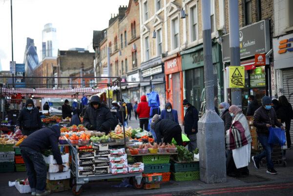 People shop at a market stalls in east London, Britain, on Jan. 23, 2021. (Henry Nicholls/File Photo/ Reuters)