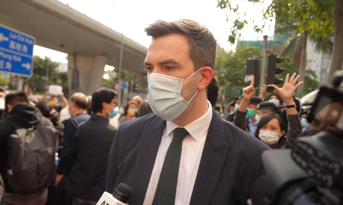 Jonathan Williams, the head of political and communications at the British Consulate-General Hong Kong, talks to reporters while waiting outside the West Kowloon Magistrates' Courts, where 47 dissidents charged under the Beijing-imposed national security law appeared in court, in Hong Kong on March 1, 2021. (Adrian Yu/The Epoch Times)