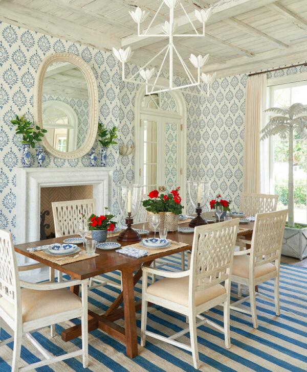 Bold prints dominate this dining room in Palm Beach, Florida, so Howard left most of the room white and for the table, kept it a neutral natural wood. (J. Savage Gibson Photography)
