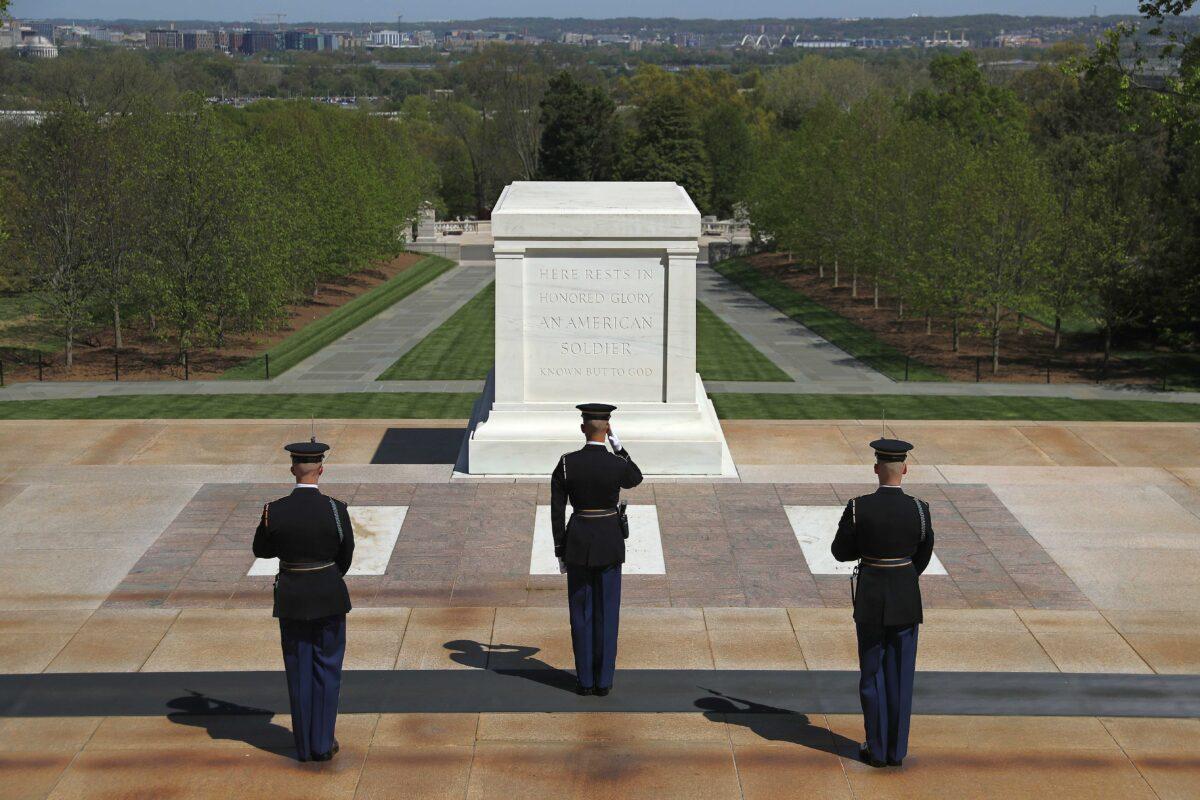 A Tomb Guard or Sentinel from the U.S. Army 3rd Infantry Regiment, also called "The Old Guard," marches in front of the Tomb of the Unknown Soldier in Arlington Cemetery in Arlington, Va., on April 22, 2020. (Chip Somodevilla/Getty Images)