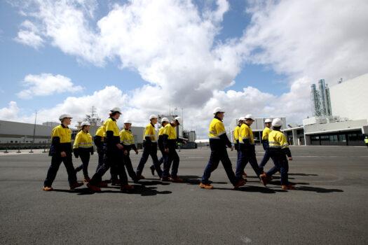 Apprentice shipbuilders walk at Osborne Naval Shipyard during a visit by Australian Prime Minister Scott Morrison in Adelaide, Australia, on Sept. 26, 2020. (Kelly Barnes/Getty Images)