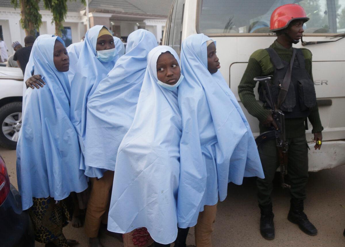 Some of the students who were abducted by gunmen from the Government Girls Secondary School in Jangebe last week, wait for a medical checkup after their release in Gusau, northern Nigeria, on March 2, 2021. (Sunday Alamba/AP Photo)