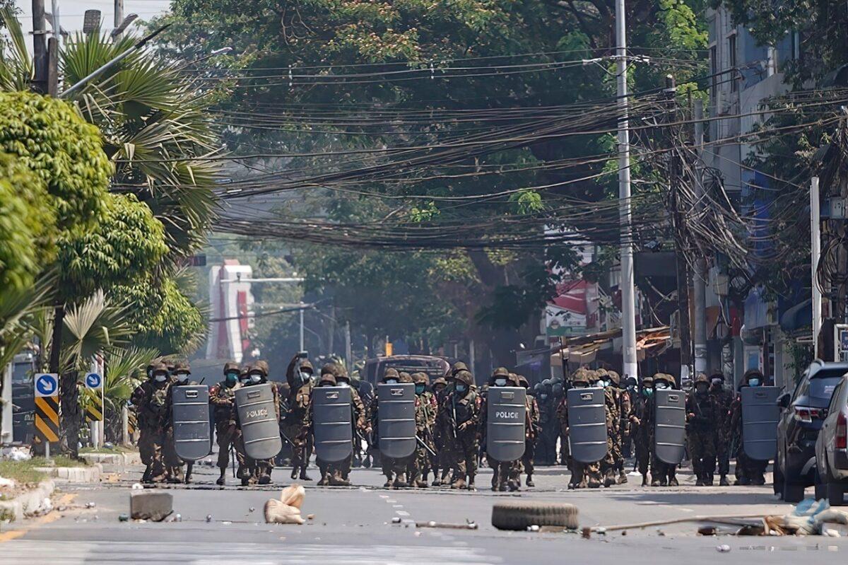 Burma military with shields move forward during a protest against the military coup in Yangon, Burma, on March 2, 2021. (AP Photo)