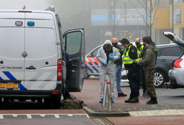 Emergency responders investigate the area at the scene of an explosion at a coronavirus disease (COVID-19) testing location in Bovenkarspel, near Amsterdam, Netherlands, on March 3, 2021. (Eva Plevier/Reuters)