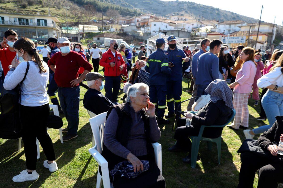 Local residents gather at a soccer field after an earthquake in Damasi village, central Greece, on March 3, 2021. (Vaggelis Kousioras/AP Photo)