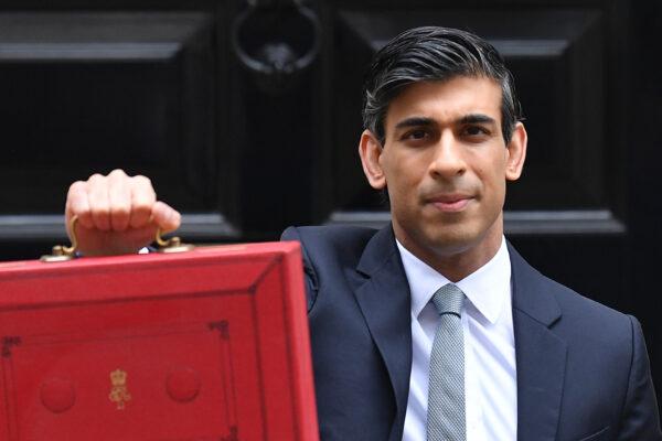 Britain's Chancellor of the Exchequer Rishi Sunak poses with the Budget Box as he leaves 11 Downing Street before presenting the government's annual budget to Parliament in London on March 3, 2021. (Justin Tallis/AFP via Getty Images)