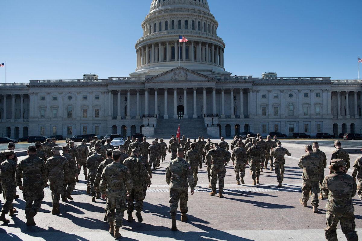Members of the National Guard are seen on the east front of the U.S. Capitol Building on Capitol Hill in Washington, D.C., on March 2, 2021. (Brendan Smialowski/AFP via Getty Images)