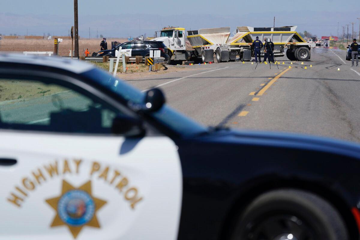 Law enforcement officers work at the scene of a deadly crash in Holtville, Calif., on March 2, 2021. (Gregory Bull/AP Photo)