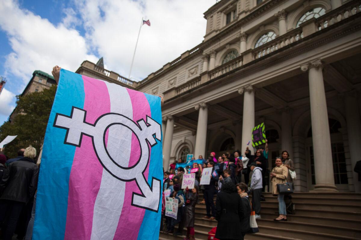 LGBT activists and their supporters rally in support of transgender people on the steps of New York City Hall, N.Y., on Oct. 24, 2018. (Drew Angerer/Getty Images)