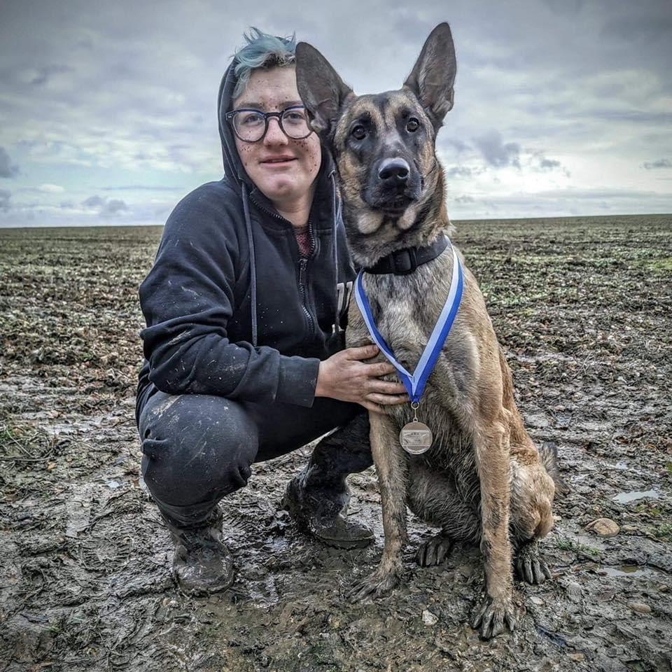 Toby Currier with his highly-trained search and rescue Belgian Malinois Nellie. (Courtesy of <a href="https://www.facebook.com/FatherTobias">Toby Currier</a>)